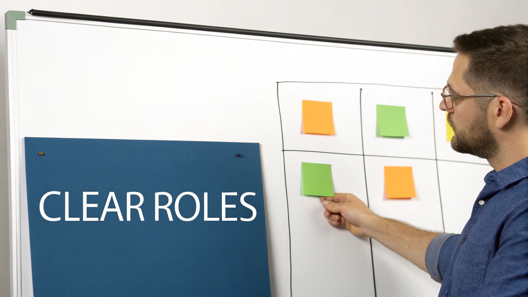 A team collaborating around a table with sticky notes, defining project roles.